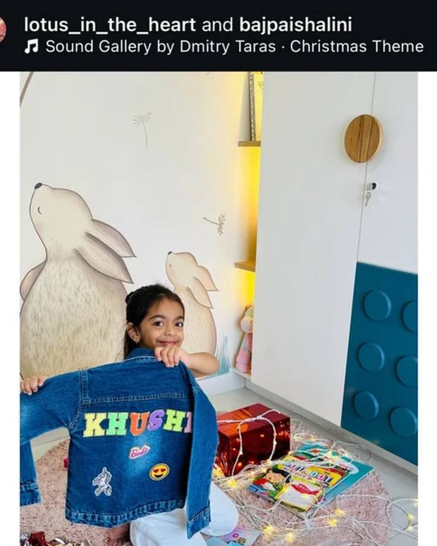 Khushi holding up her personalised denim jacket